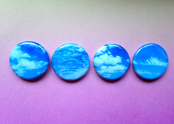 Four small round button badges with cloud designs kate wimbush jewellery