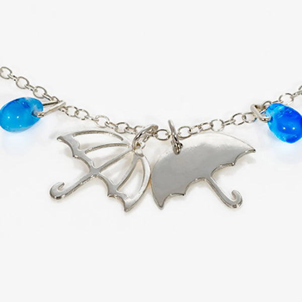 Silver Umbrella Bracelet Charms with blue glass raindrop beads by Kate Wimbush Jewellery