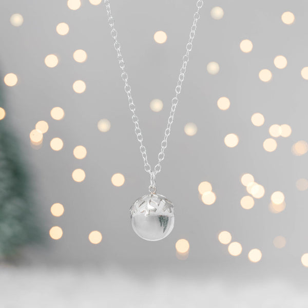 Silver Snowflake Rock Quartz Orb Pendant on chain with fairy lights and Christmas tree, Kate Wimbush Jewellery