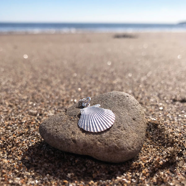 Silver clam shell pendant necklace on Scarborough beach by Kate Wimbush Jewellery