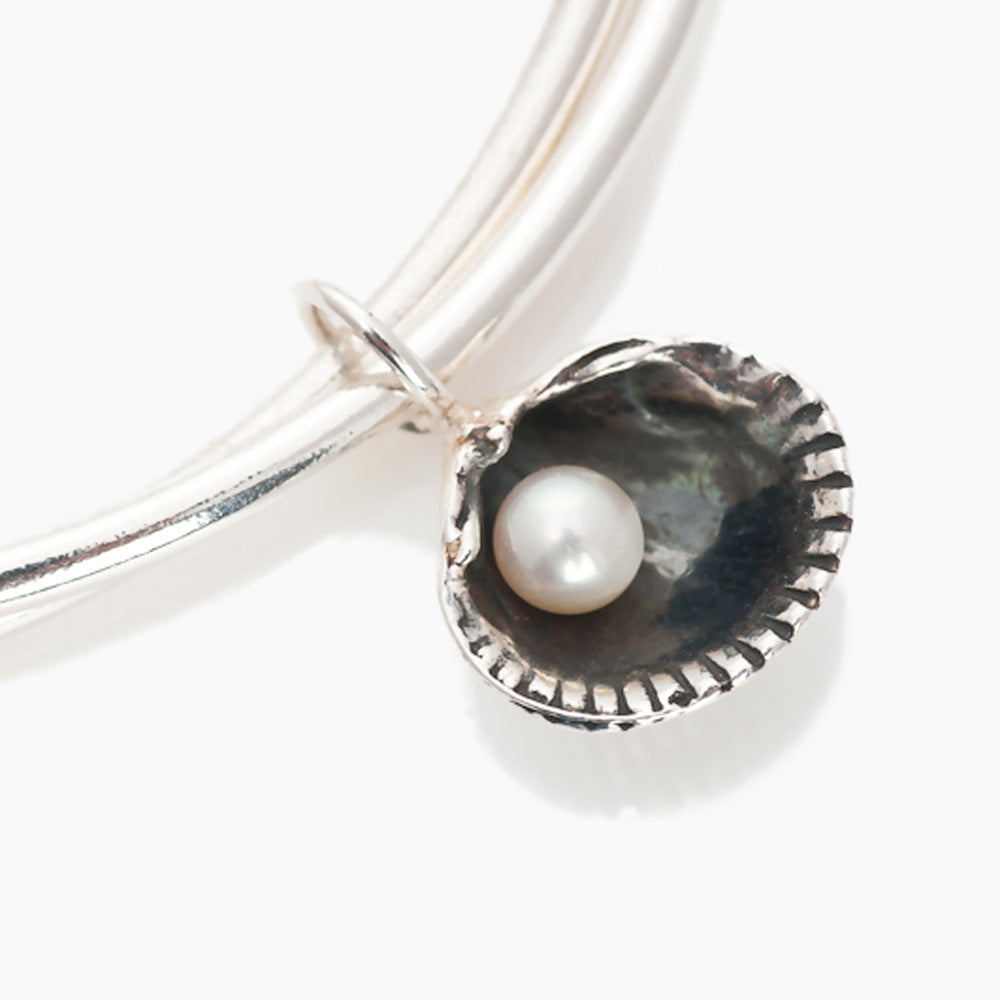 Silver Cockle Shell Charm on double bangle, white background cut out, by Kate Wimbush jewellery