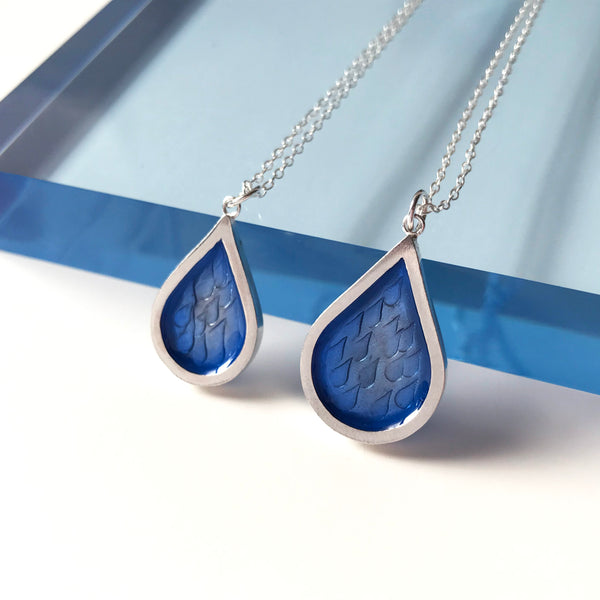 small and large hand stamped raindrop pendant with blue resin by Kate Wimbush Jewellery