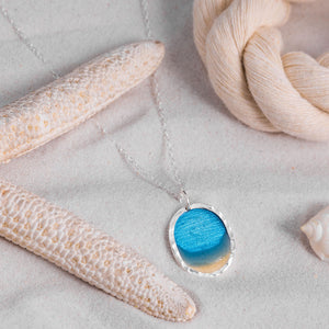 Large Silver Lagoon Blue Beach Scene pendant with textured bezel, by Kate Wimbush Jewellery