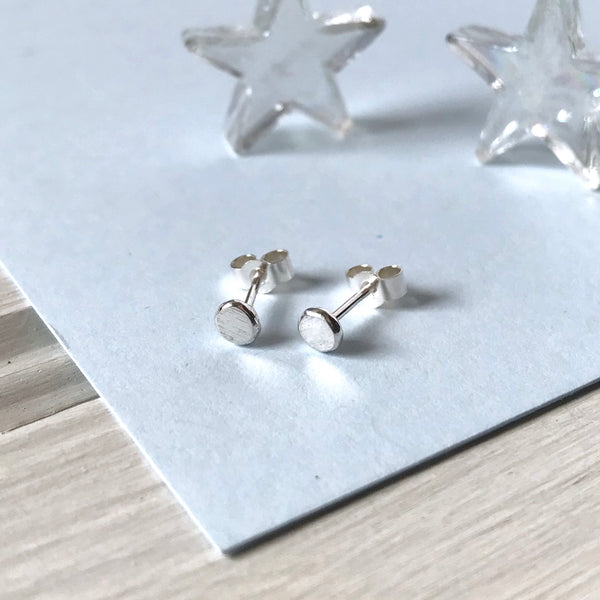Recycled silver flat stud earrings with butterfly backs on earring card by Kate Wimbush Jewellery