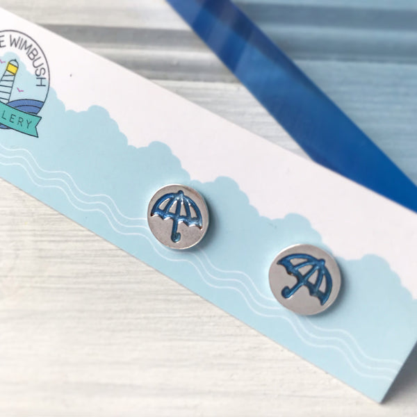 Round Silver Umbrella Stud earrings with blue resin on earring card by Kate Wimbush Jewellery