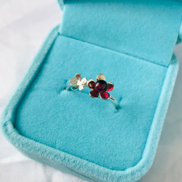 Silver flower ring with garnet by Kate Wimbush jewellery