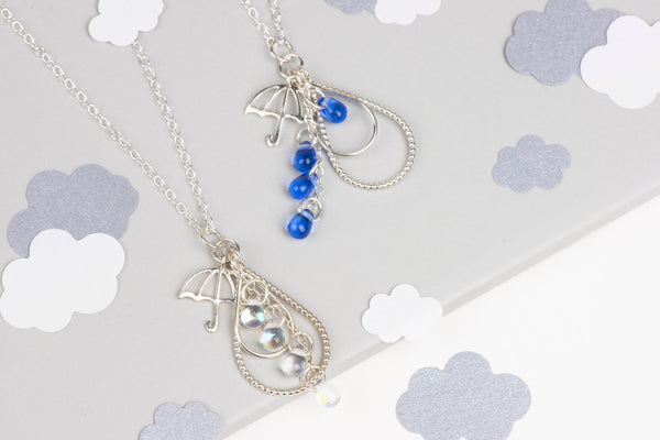 Two Silver Raindrop Umbrella Charm Pendants with Blue and Aura Glass Raindrop Beads by Kate Wimbush Jewellery
