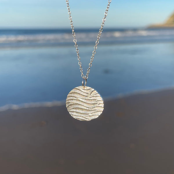 Round Silver Ripple Pendant at the seaside by Kate Wimbush Jewellery