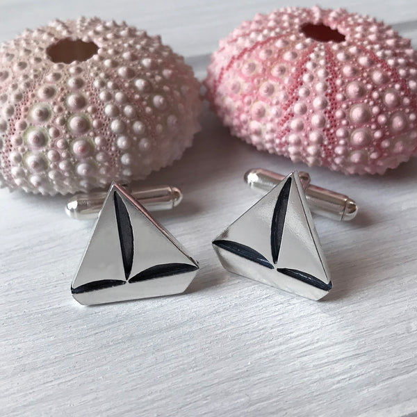 Silver Boat Yacht t-bar cufflinks on wooden background by Kate Wimbush Jewellery