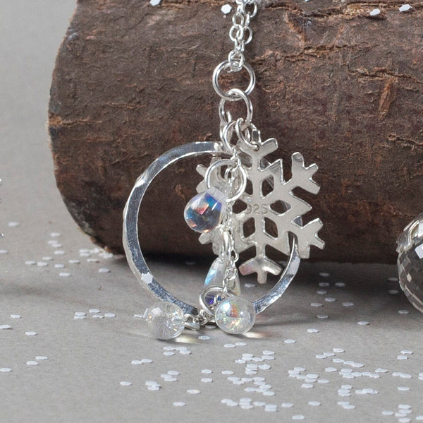 Silver snowflake charm pendant with circle charm and clear snowdrop glass beads by Kate Wimbush Jewellery