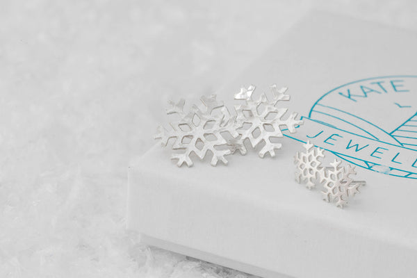 Large and Small Silver Snowflake Studs on Kate Wimbush Jewellery branded box