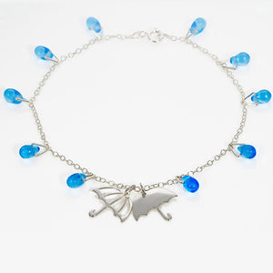 Silver Umbrella Charm Bracelet with blue glass raindrop beads by Kate Wimbush Jewellery