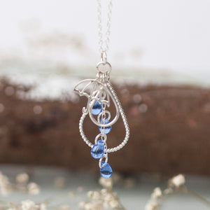 Silver Umbrella Raindrop Charm Pendant on chain with blue glass raindrop beads by Kate Wimbush Jewellery