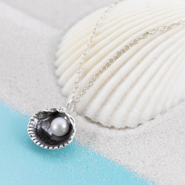 Small Oxidised Cockle shell pendant on chain with white freshwater pearl by Kate Wimbush Jewellery